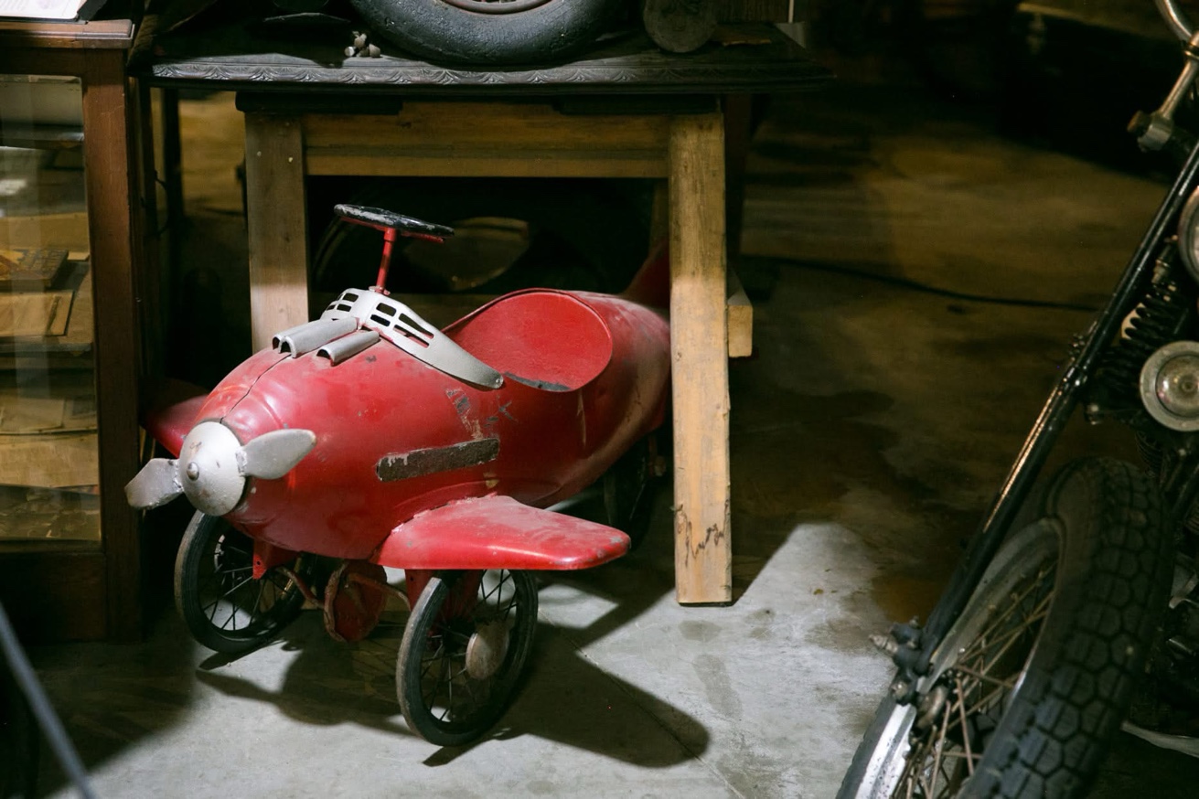 Vintage red pedal airplane toy